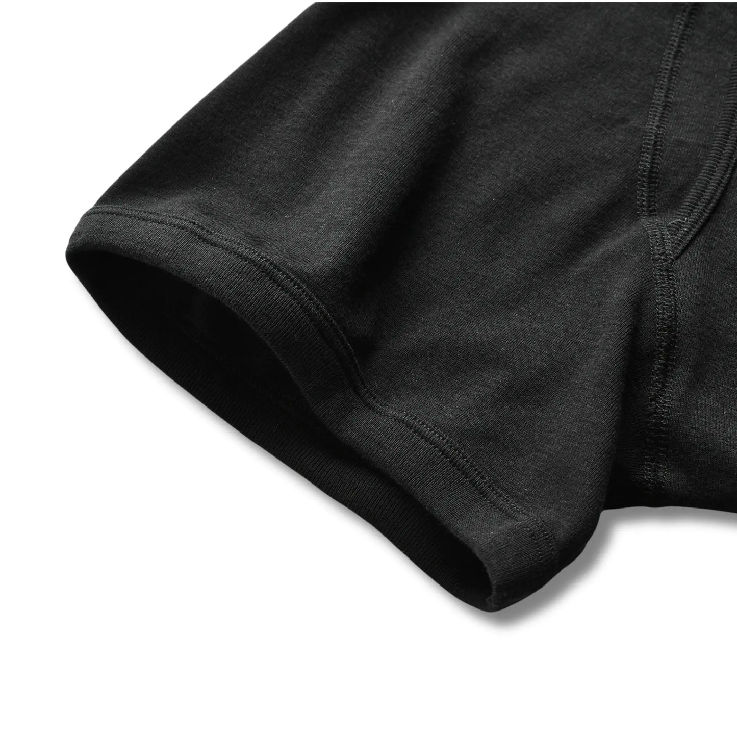 Close-up of black 100% cotton boxer briefs showing smooth leg opening and soft fabric for everyday comfort.