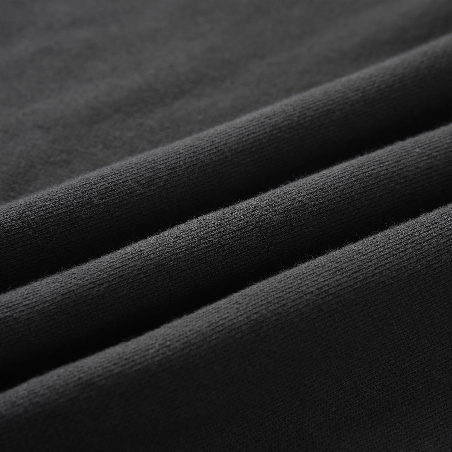 Close up of the Pagulayan Men’s Pocket Hoodie fabric showing its smooth, soft knit texture.