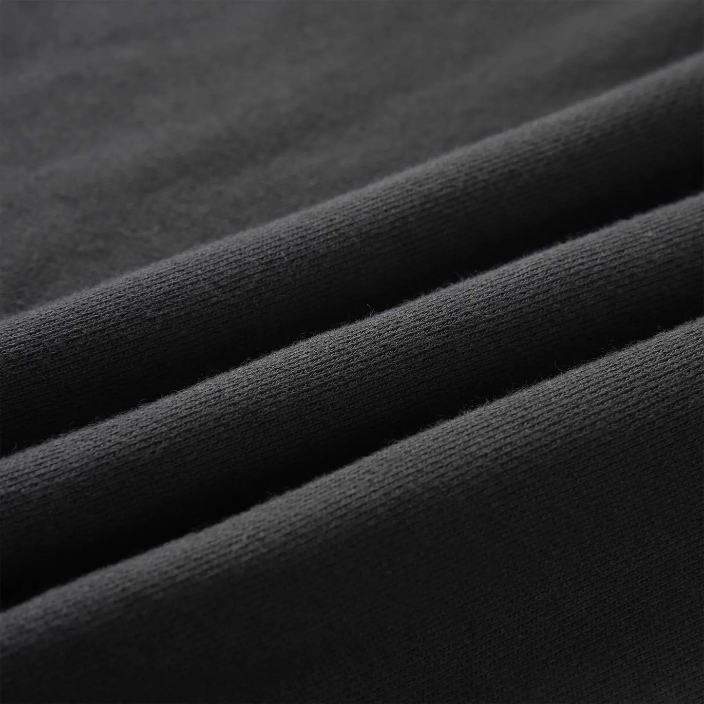 Close up of the Pagulayan Men’s Pocket Hoodie fabric showing its smooth, soft knit texture.