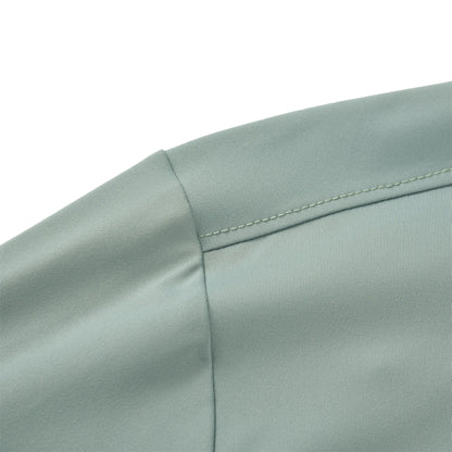 The image shows the stitched shoulder seam of the Team Ontario billiards jersey in light sage green fabric.