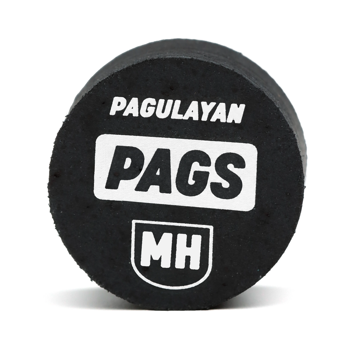 Straight-on view of PAGS Medium Hard pool cue tip with Pagulayan branding and MH hardness marking.