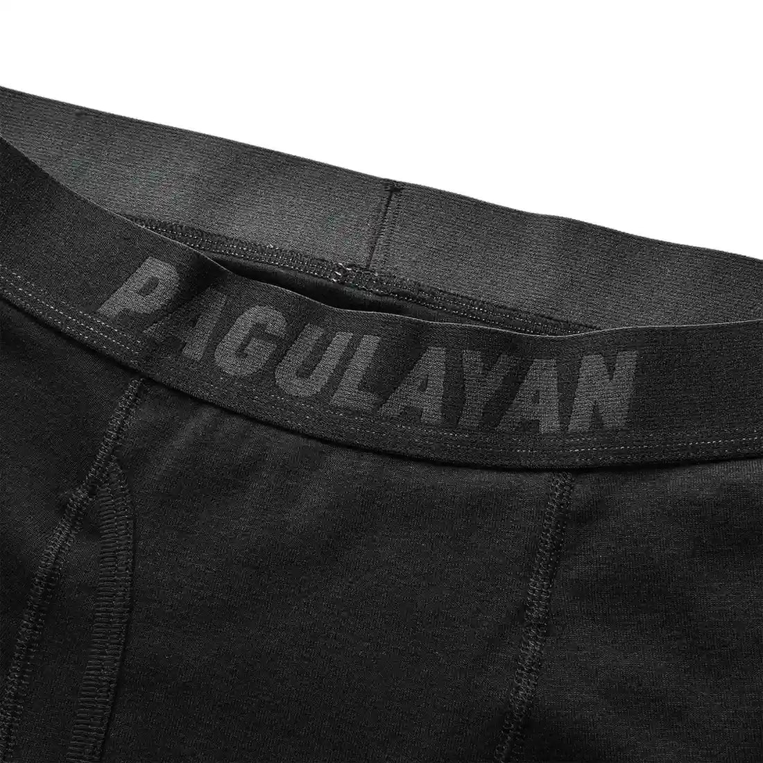 Close-up of black 100% cotton boxer briefs waistband with Pagulayan branding and soft elastic fit.