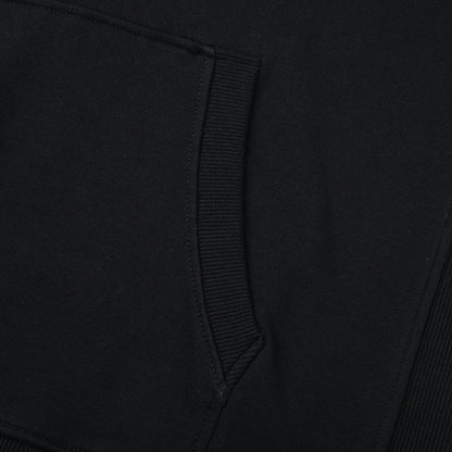 Close-up of the Blackout Hoodie kangaroo pocket showing the ribbed trim and clean stitching.