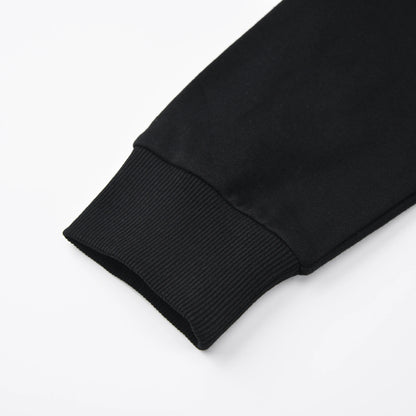 Close up of the Pagulayan Blackout Hoodie sleeve showing the ribbed cuff and smooth black fabric.