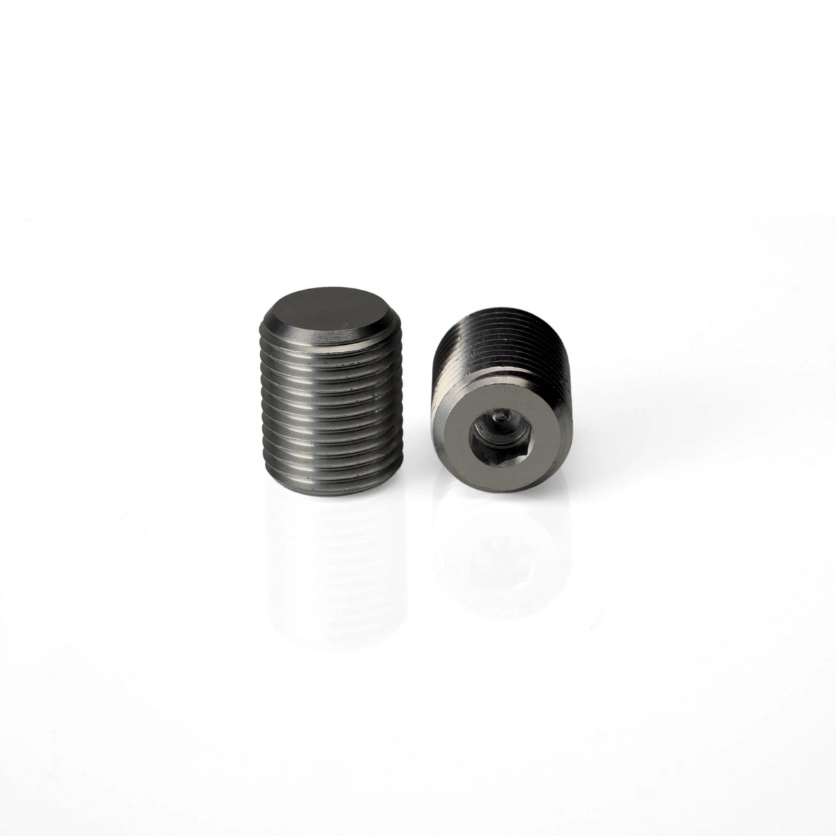 Two Pagulayan cue weight bolts with one positioned to show the recessed Allen wrench socket.