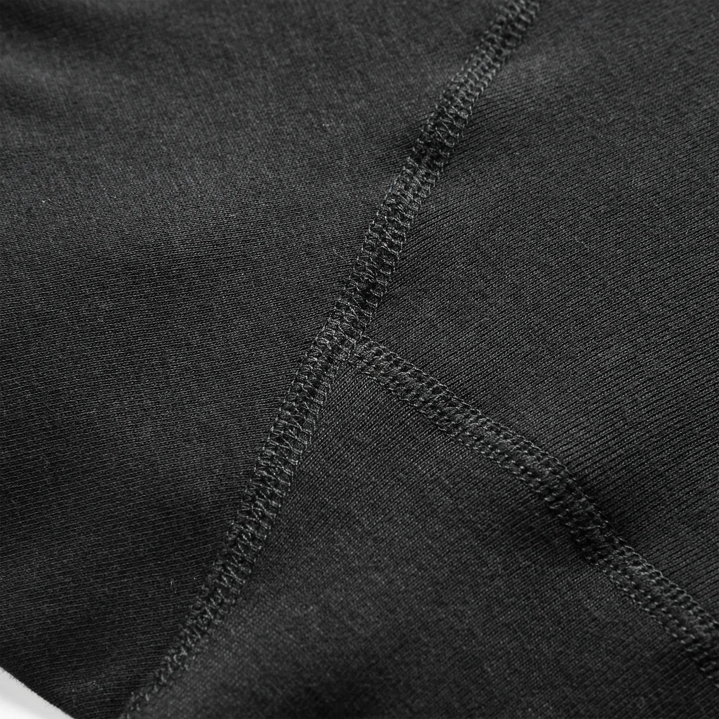 Close-up of black 100% cotton boxer briefs inner seam showing smooth stitching designed to reduce chafing.