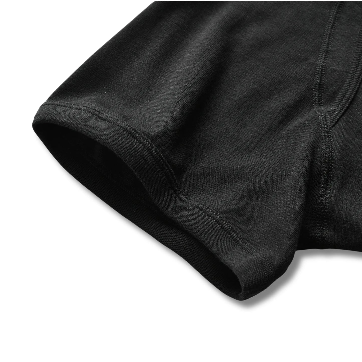 Close-up of black 100% cotton boxer briefs showing smooth leg opening and soft fabric for everyday comfort.
