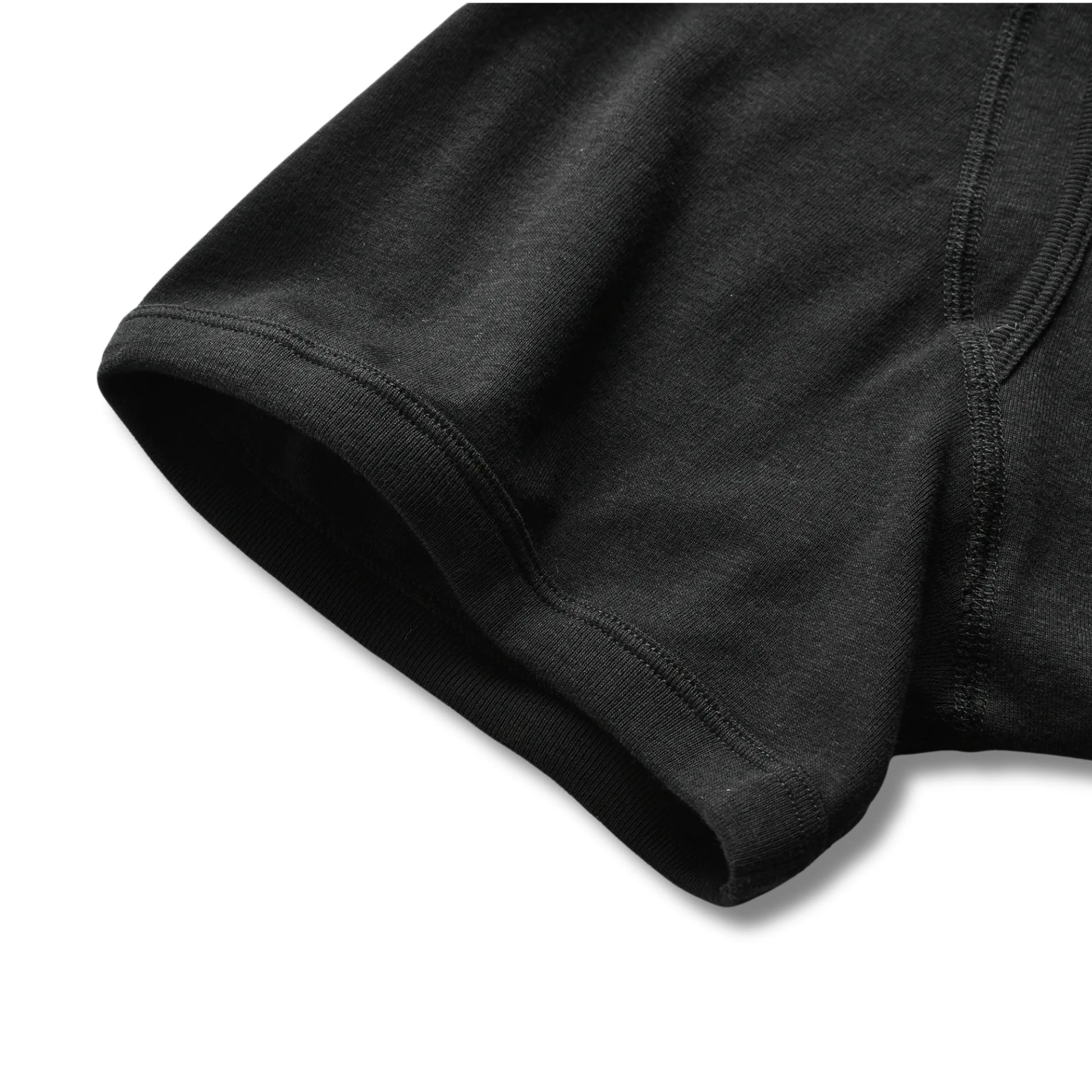 Close-up of black 100% cotton boxer briefs showing smooth leg opening and soft fabric for everyday comfort.