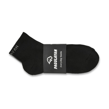 Side view of Pagulayan Everyday black crew sock showing fit, shape, and branded packaging.