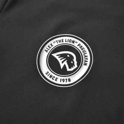 Close-up of the Pagulayan circular chest logo featuring the lion emblem and the text “Alex ‘The Lion’ Pagulayan Since 1978.”
