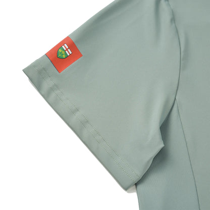 Close-up of the Ontario Team Jersey sleeve showing the printed provincial flag on light green fabric.