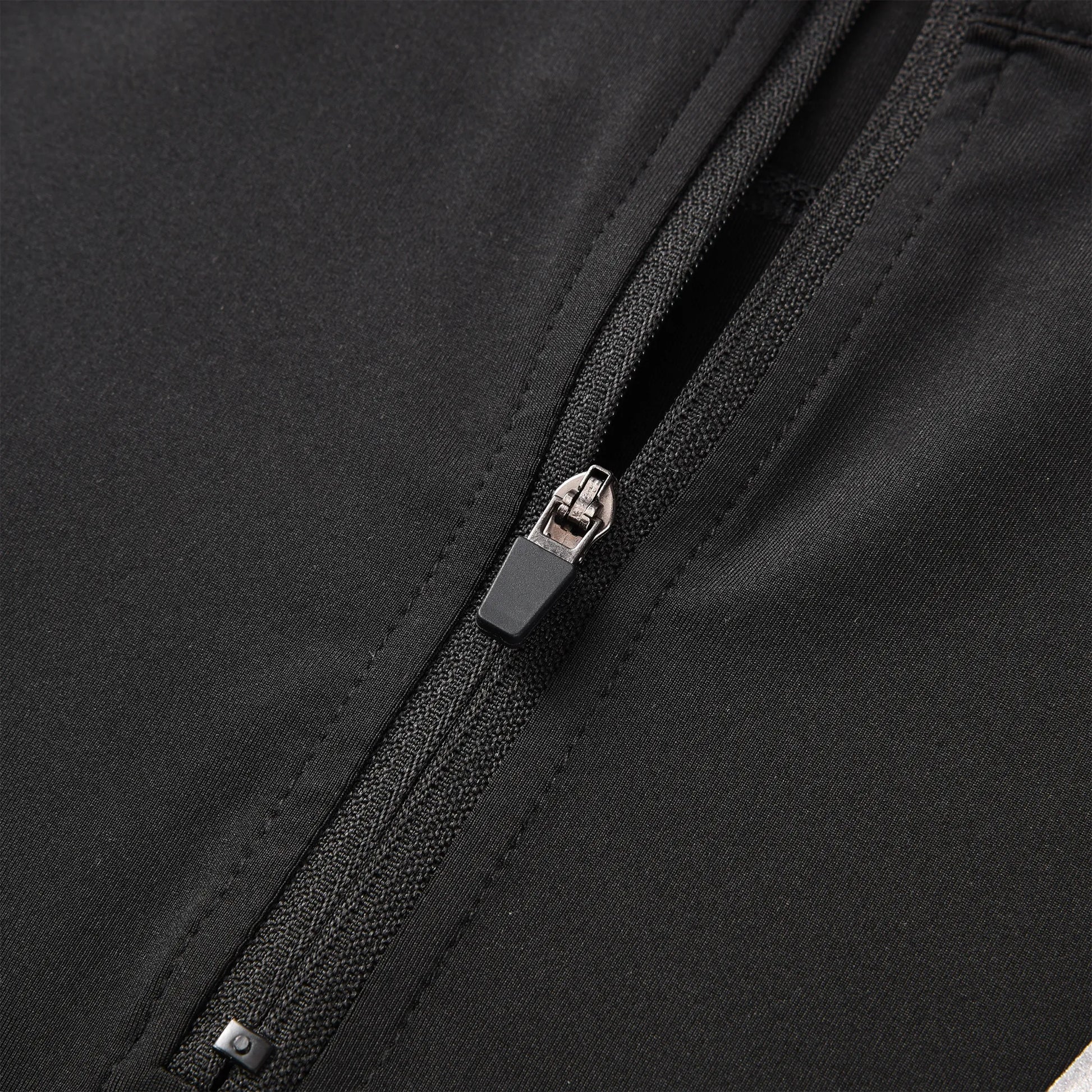 Close-up view of the Pagulayan Jersey zipper showing the smooth black fabric and durable zip design.