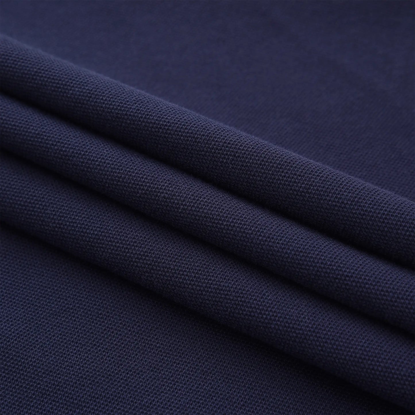 Close-up of navy cotton pique fabric used in the Pagulayan Just Right polo shirt, breathable and comfortable material.