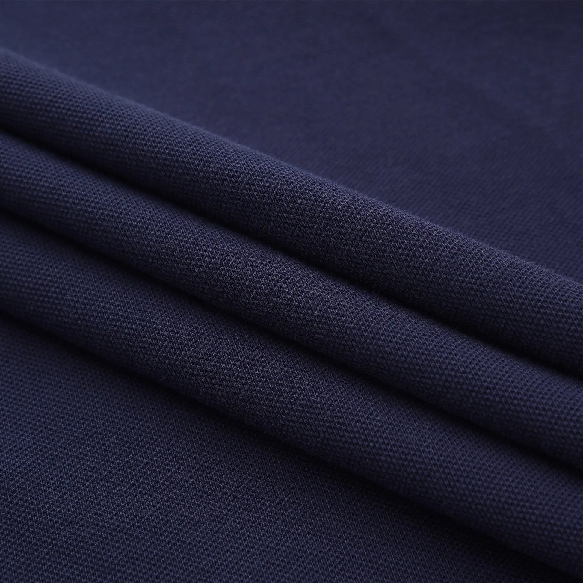 Close-up of navy cotton pique fabric used in the Pagulayan Just Right polo shirt, breathable and comfortable material.