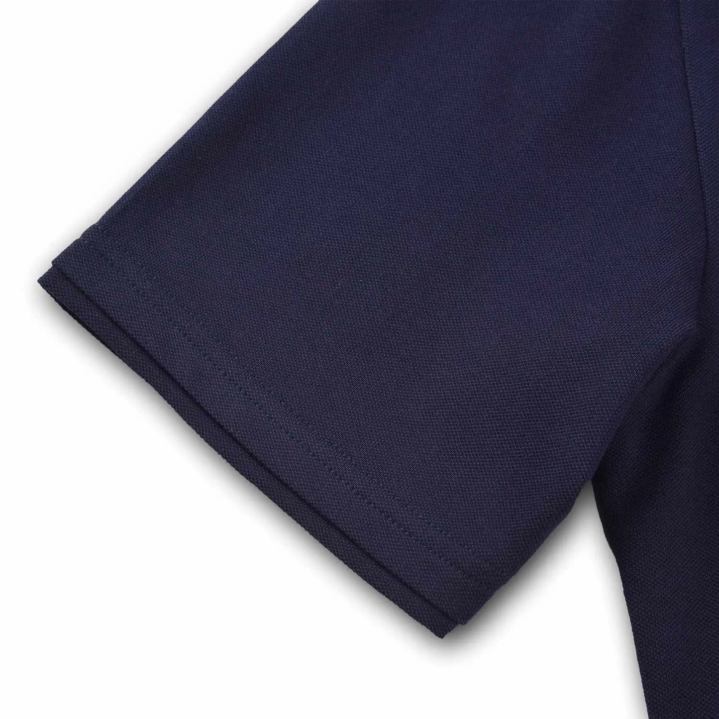 Close-up of navy sleeve hem on Pagulayan Just Right cotton pique polo shirt showing durable stitching and fabric.