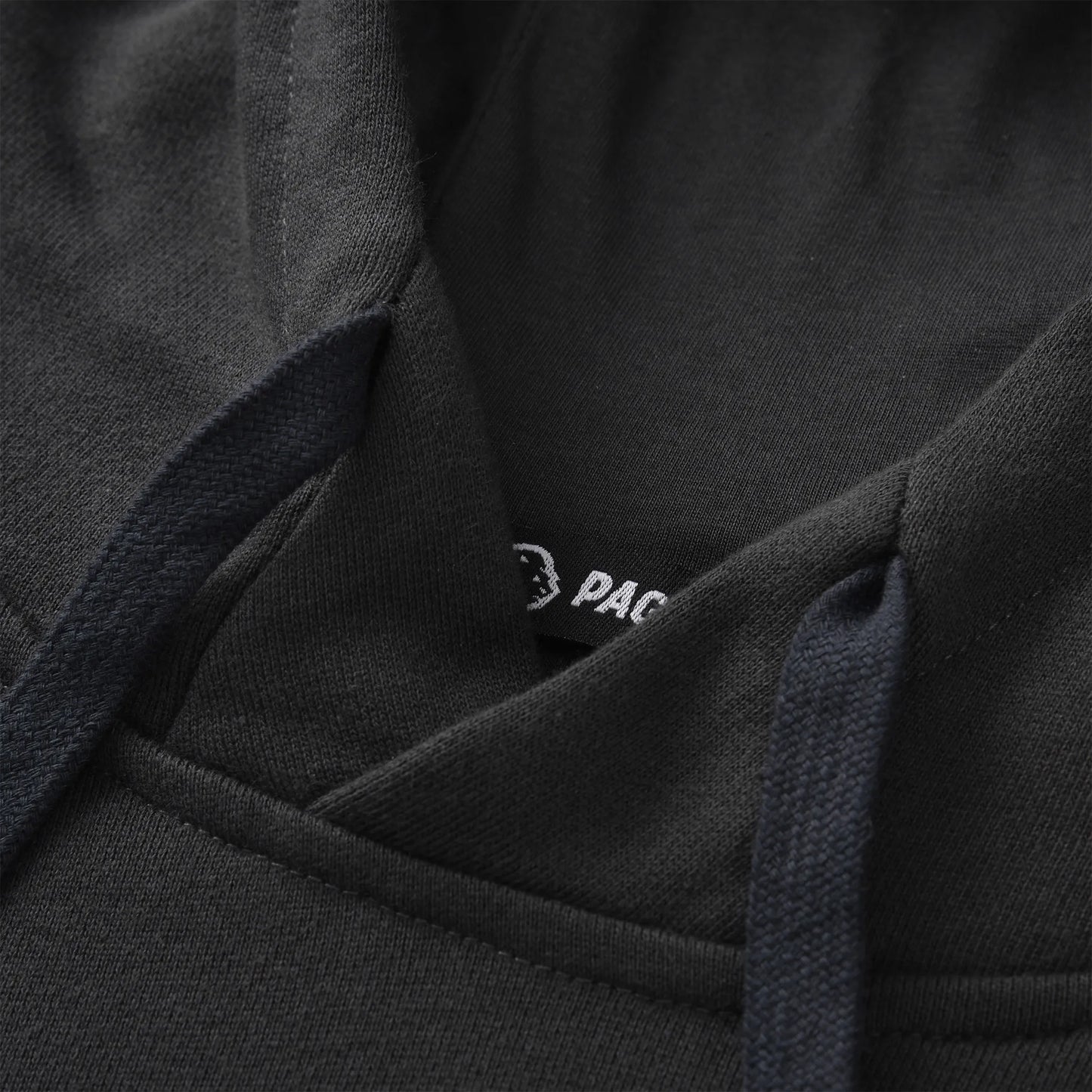 Close up of the Pagulayan Men’s Pocket Hoodie showing the hood stitching, drawstrings, and inner label detail.