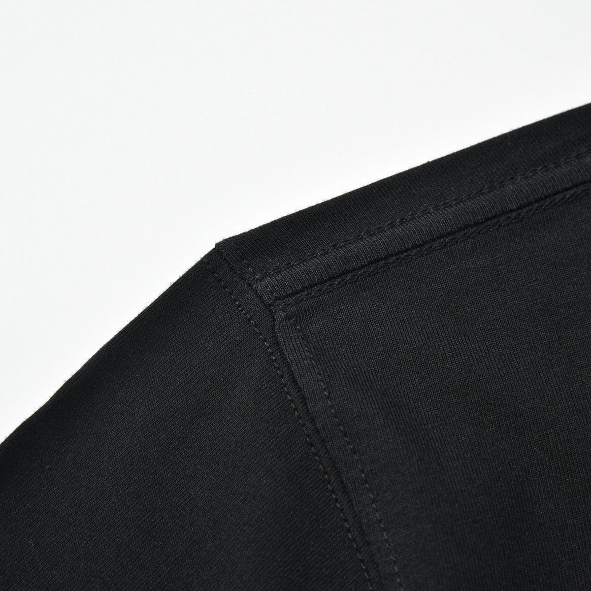 Close-up of the black Pagulayan PAGS Shirt shoulder seam and stitching.