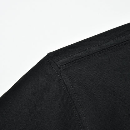 Close-up of the black Pagulayan PAGS Shirt shoulder seam and stitching.
