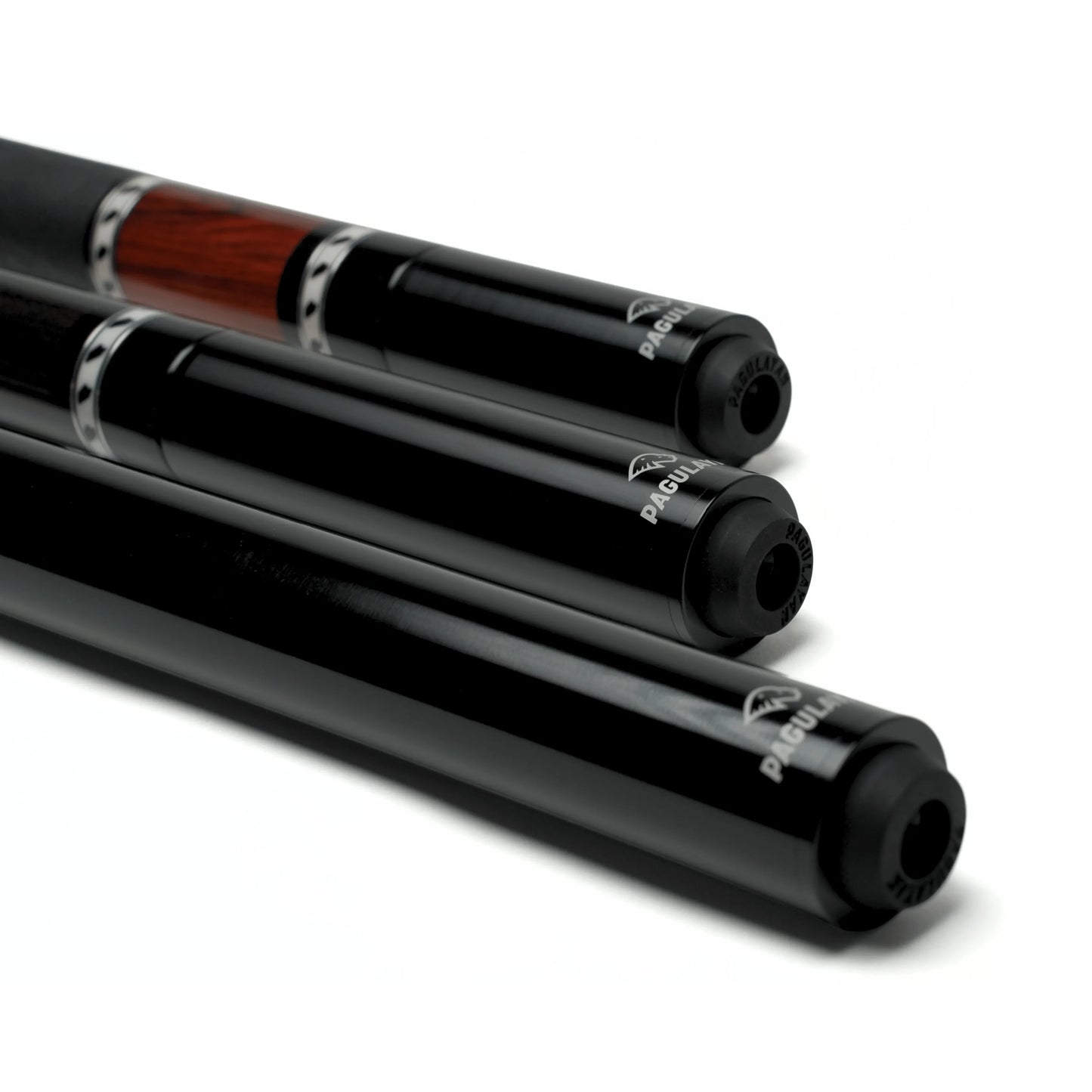 Close-up of Pagulayan pool cue extensions installed on three billiard cues with different wood finishes.