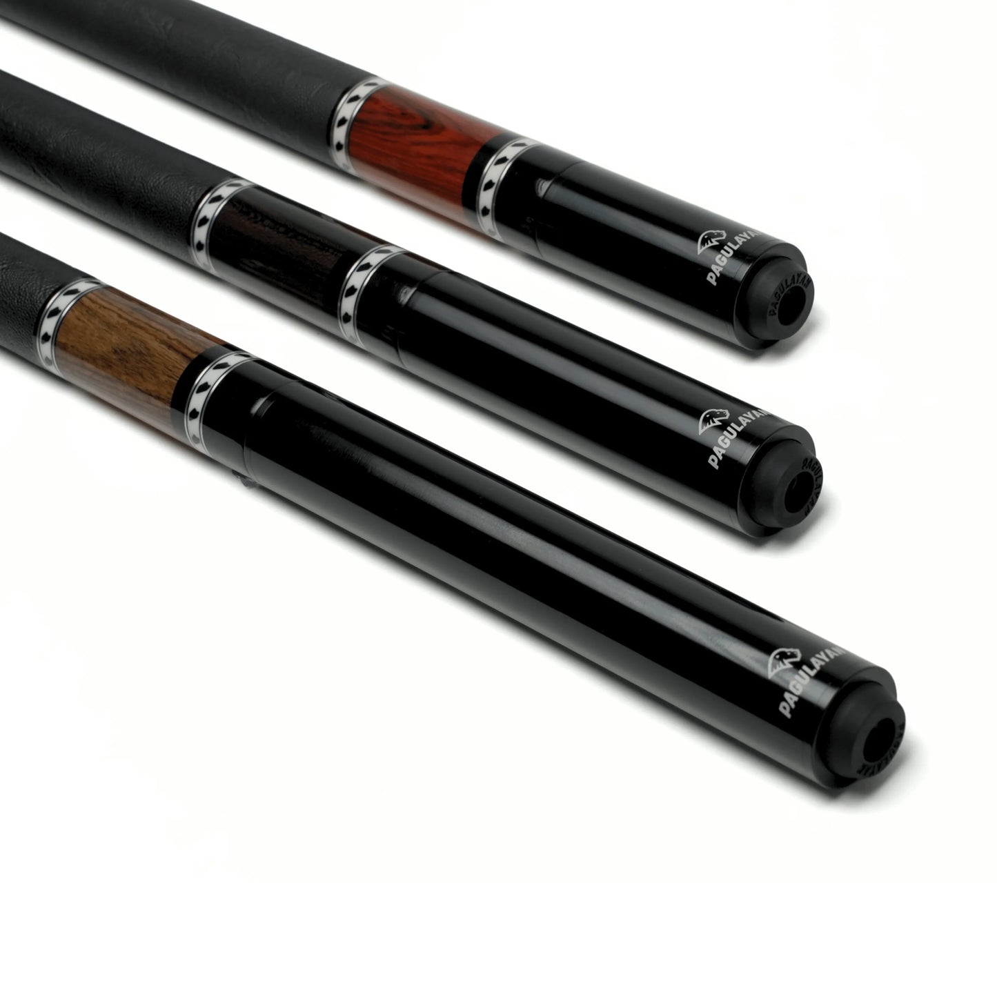 Pagulayan pool cue extensions installed on three billiard cues with different wood designs.
