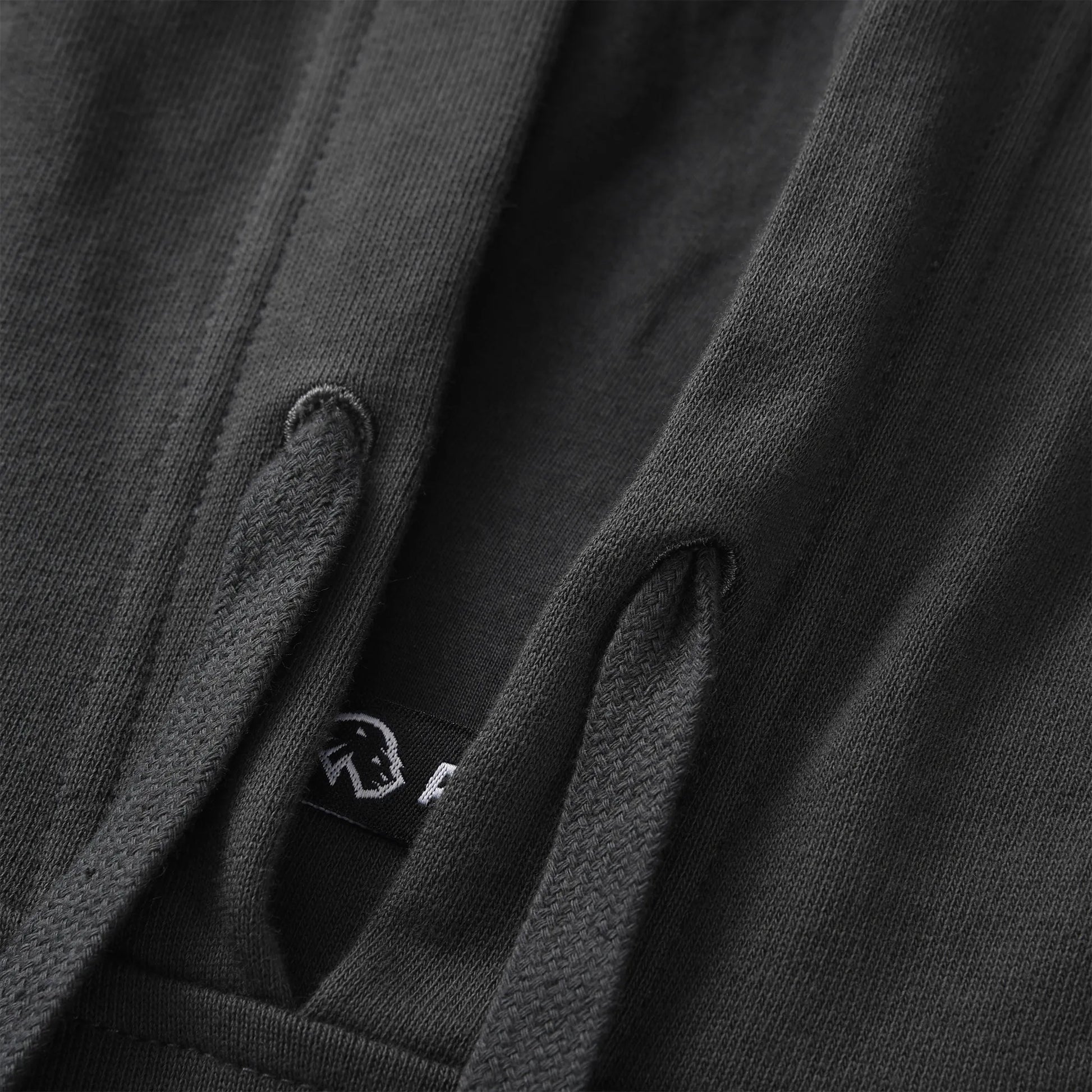 Close up of the Pagulayan Puff Logo Hoodie drawstrings showing the textured cords and inner label detail.