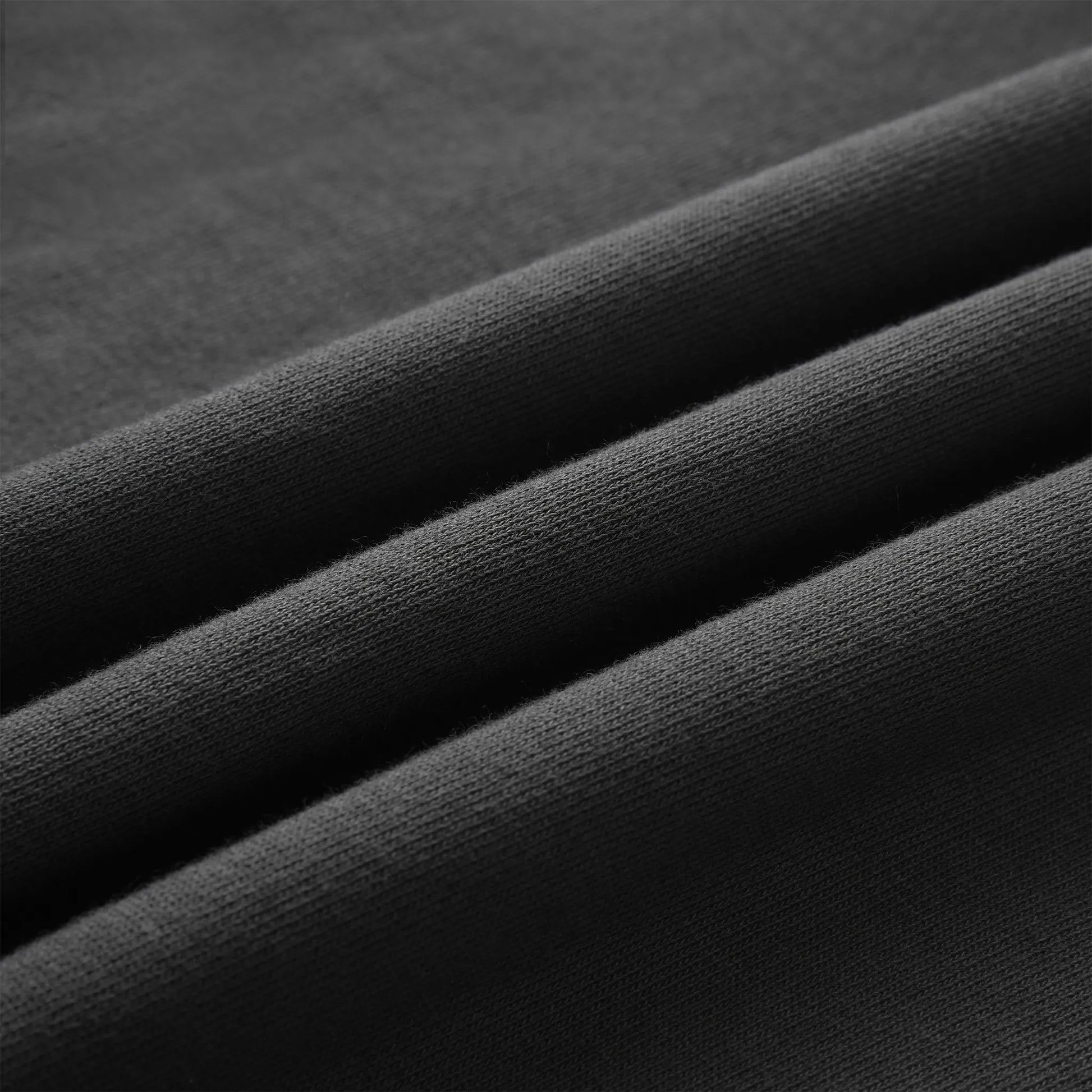 Close up of the Pagulayan Puff Logo Hoodie fabric showing its smooth knit texture and soft finish.