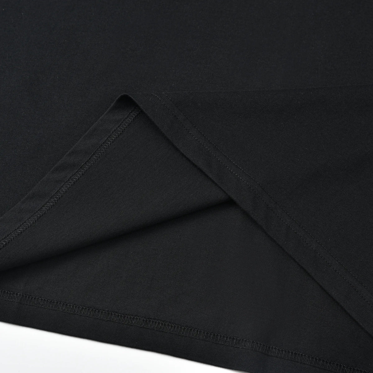 Close-up of the bottom hem and interior stitching on the black Small Pagulayan Logo Shirt.