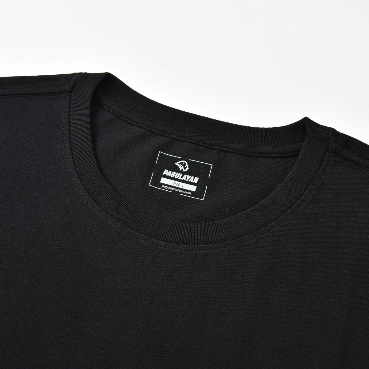 Close-up of the Small Pagulayan Logo Shirt crew neck collar with printed Pagulayan label.