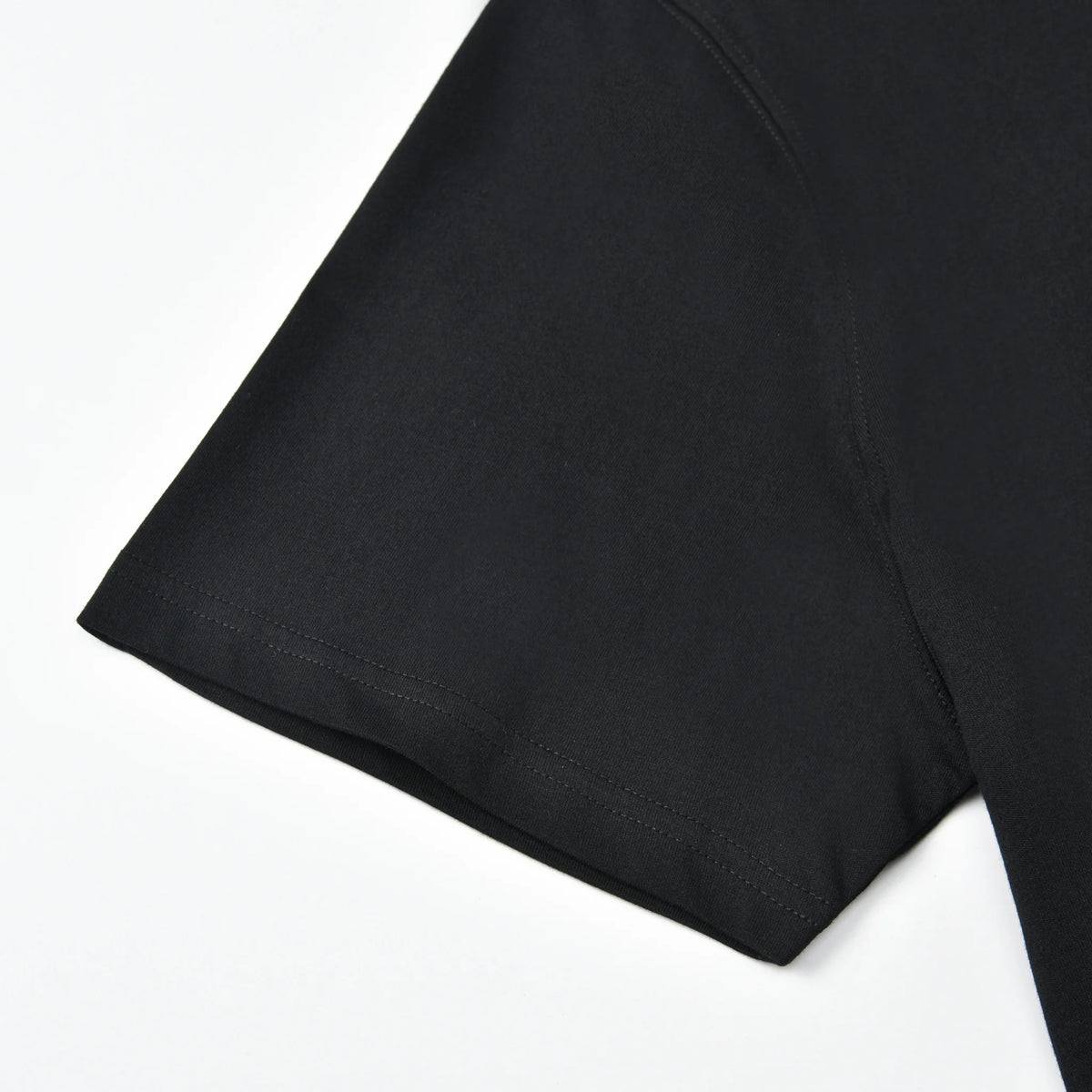Close-up of the sleeve and stitching detail on the black Small Pagulayan Logo Shirt.