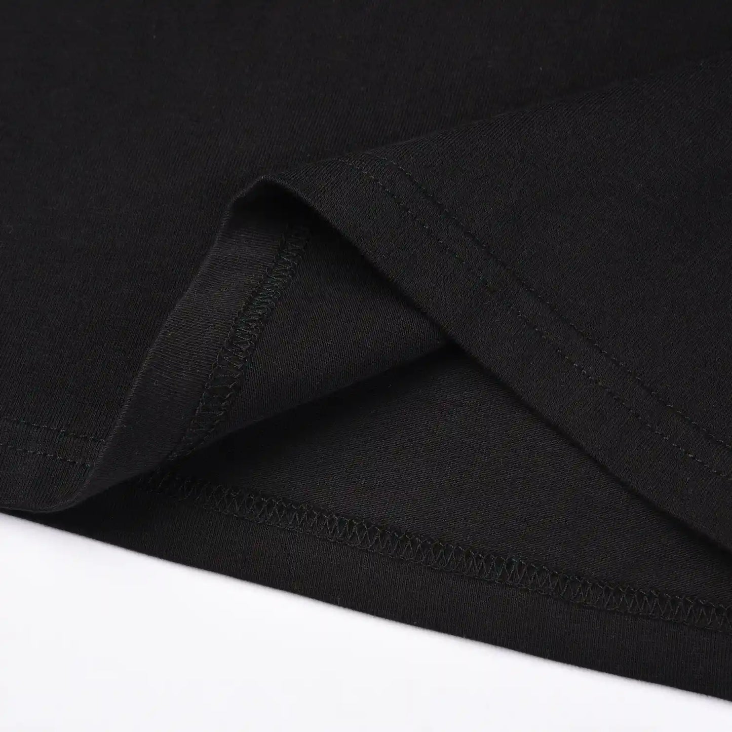 Close up of hem stitching and fabric detail on Pagulayan Stealth Logo black cotton t shirt.