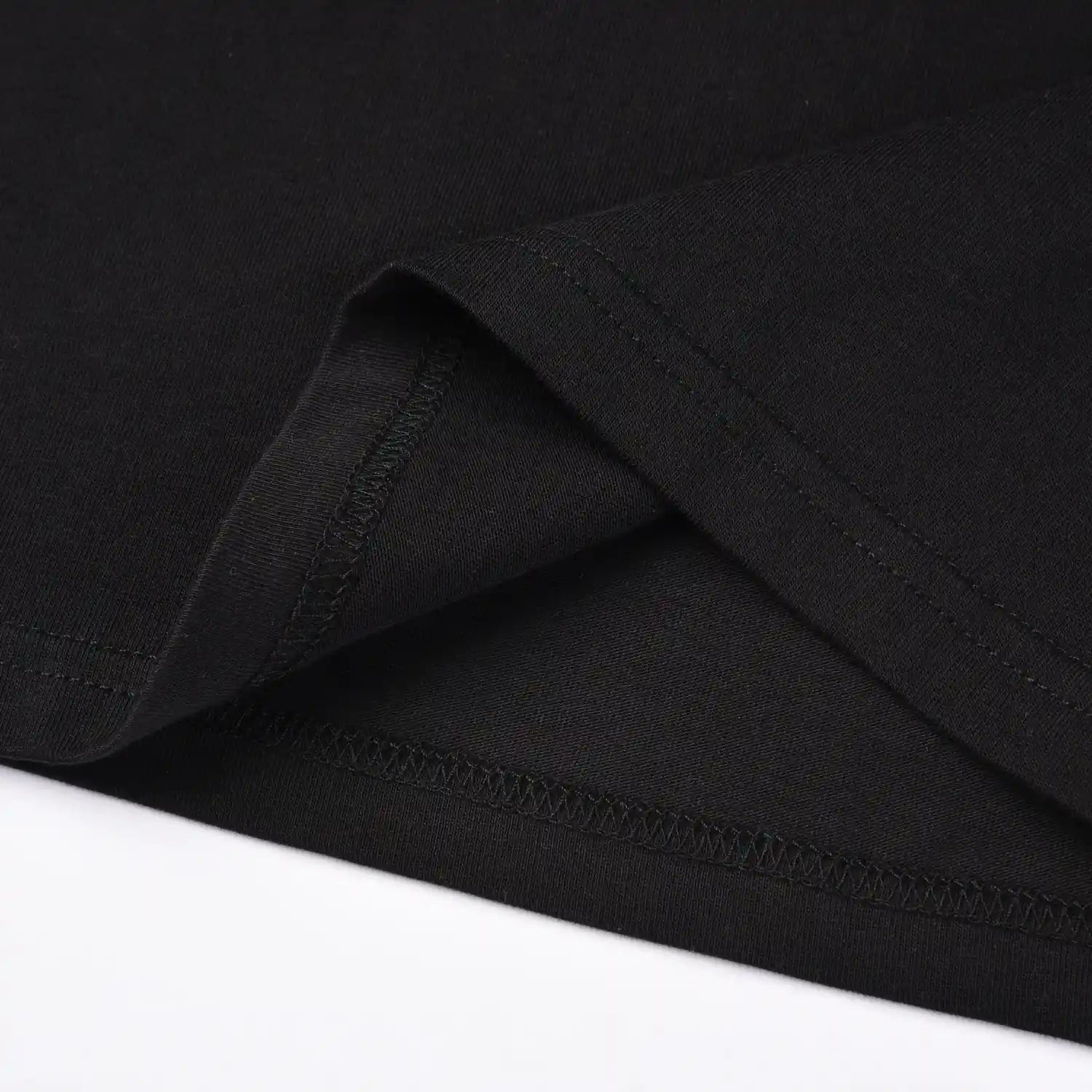 Close up of hem stitching and fabric detail on Pagulayan Stealth Logo black cotton t shirt.
