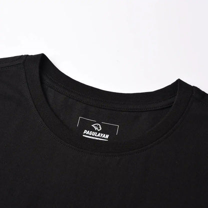 Close up of Pagulayan Stealth Logo black cotton t shirt ribbed crewneck collar and tagless label.