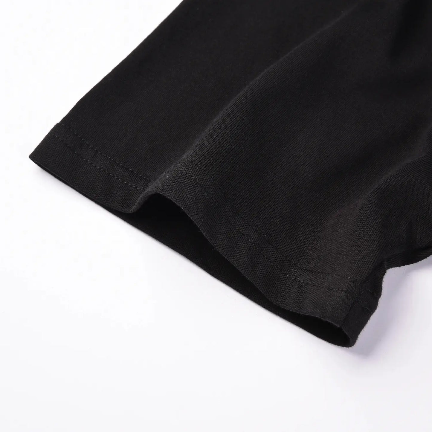 Close up of sleeve stitching on Pagulayan Stealth Logo black cotton t shirt.