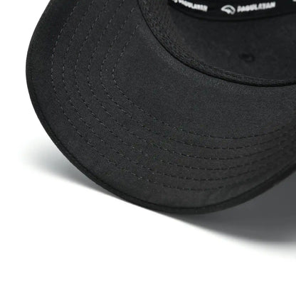 Close-up of Pagulayan Stealth Logo black snapback cap curved brim showing stitched bill detail.