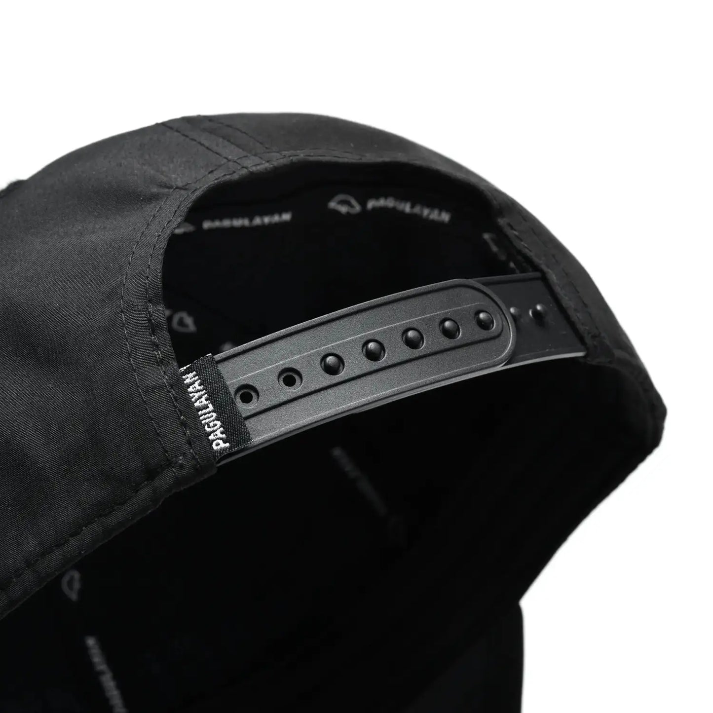 Close-up of Pagulayan Stealth Logo black snapback cap adjustable snapback closure at the back.