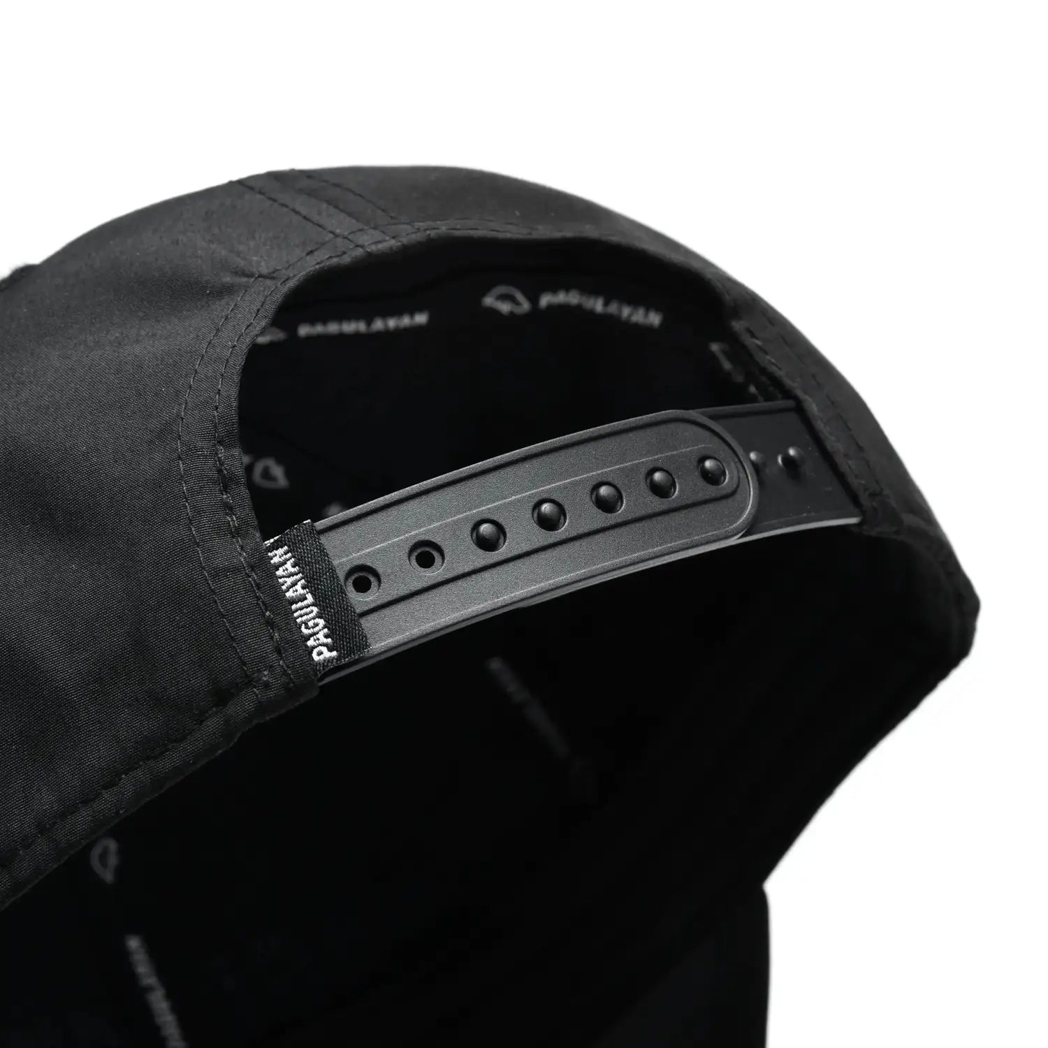 Close-up of Pagulayan Stealth Logo black snapback cap adjustable snapback closure at the back.