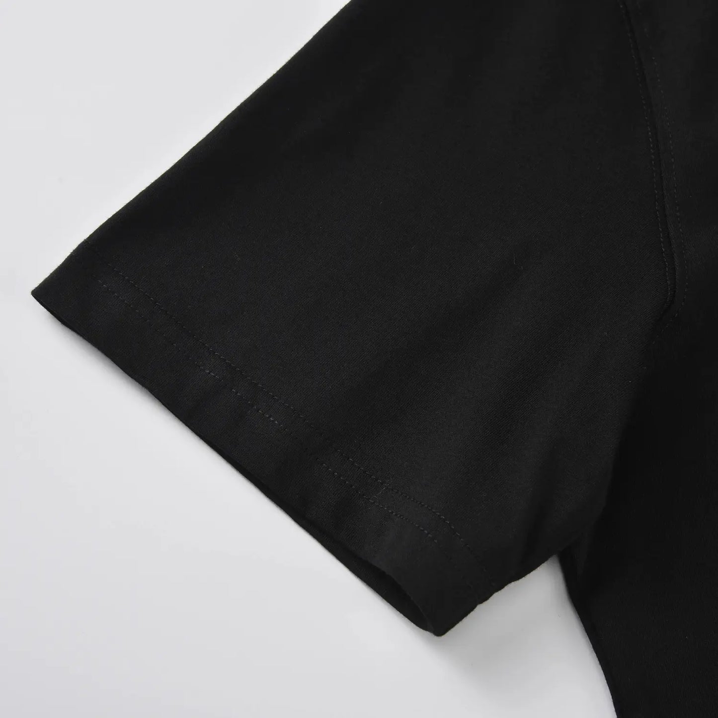 Sleeve stitching detail on The Subtle T-Shirt by Pagulayan minimalist black cotton t shirt.