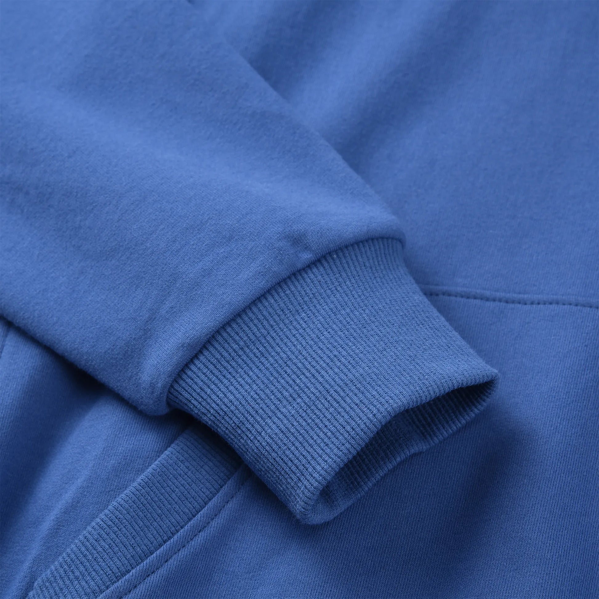 Close up of the Pagulayan Women’s Drop-Shoulder Pocket Hoodie sleeve showing the ribbed cuff and soft fabric texture.