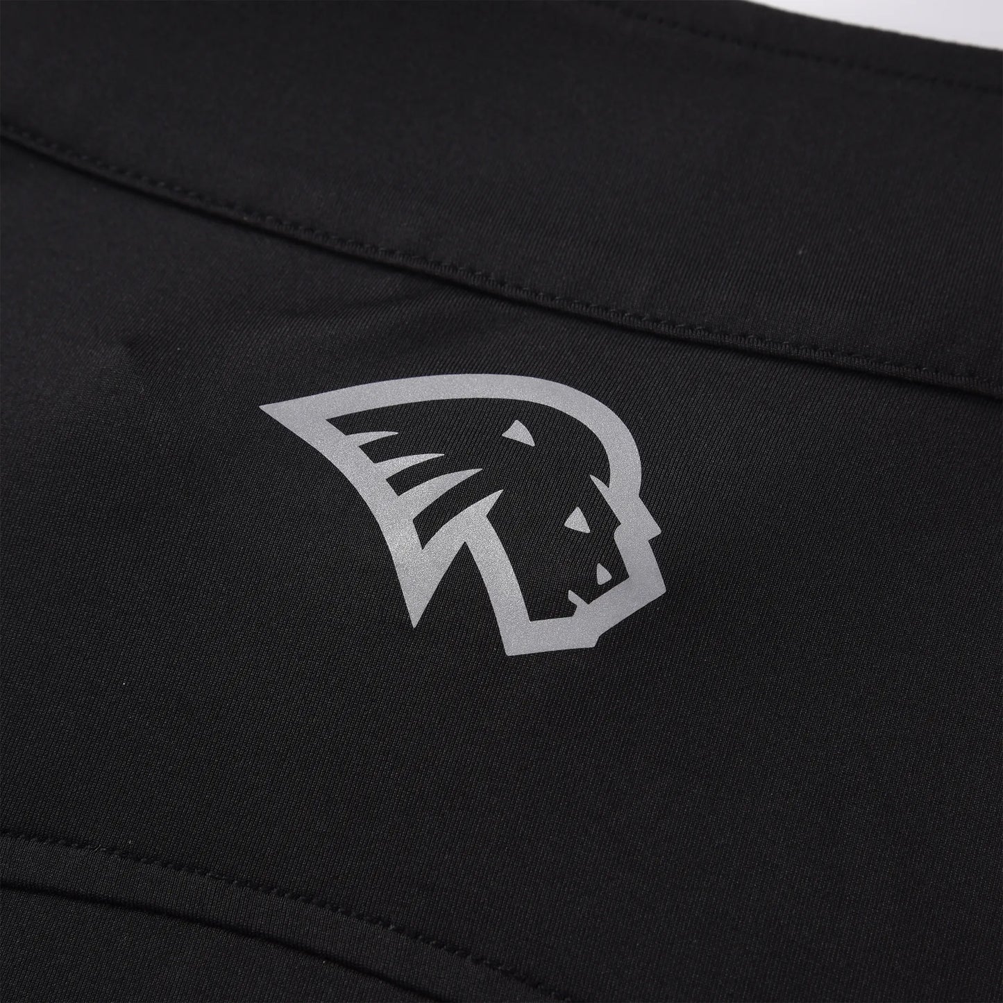 Close-up of the Pagulayan lion logo printed on the back collar of the Women’s Team Canada billiards jersey.