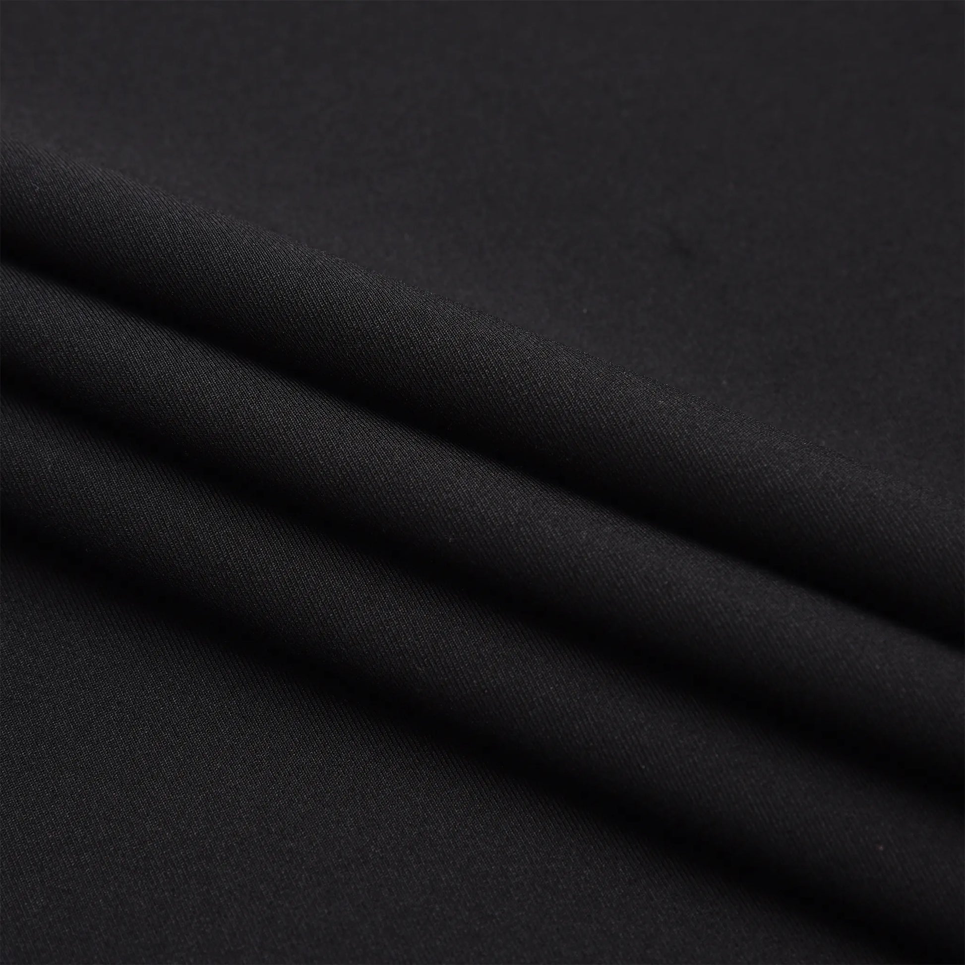 Close-up of the soft black fabric used in the Pagulayan Women’s Team Canada billiards jersey.
