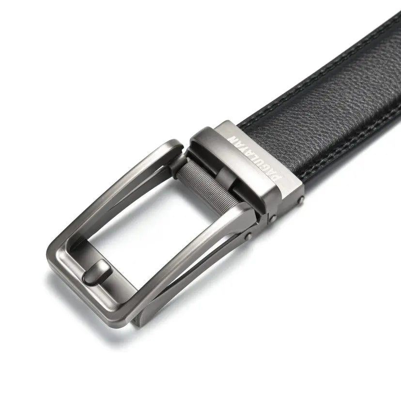 Close-up of a premium black ratchet leather belt featuring a gunmetal click-lock buckle and micro-adjustable hole-free track system.