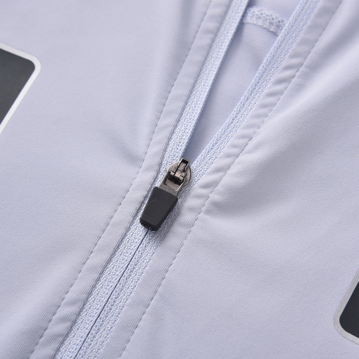 A detailed close-up of the zipper on the Pagulayan Quebec billiards jersey showing the white fabric and precise stitching.