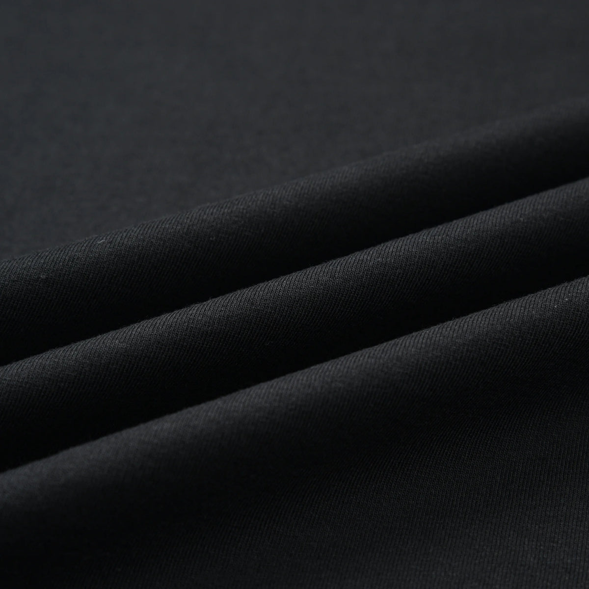 Close-up of the black fabric texture on the Stripe Pagulayan Logo Shirt.