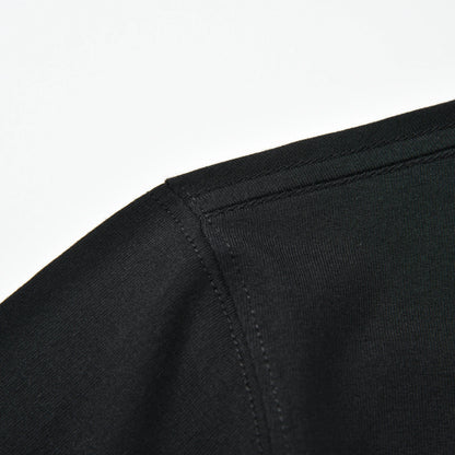Close-up of the shoulder seam and stitching on the black Stripe Pagulayan Logo Shirt.