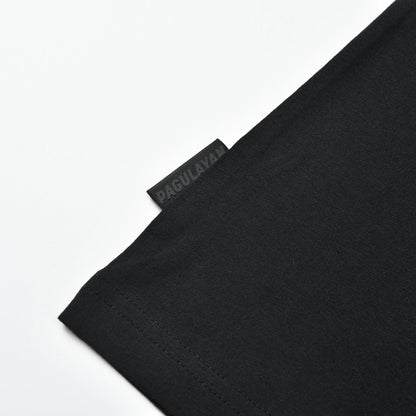 Close-up of the Pagulayan logo tag near the waist of the black Stripe Pagulayan Logo Shirt.