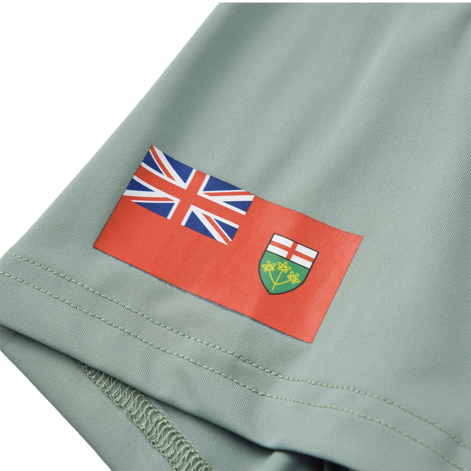 The jersey sleeve showing the Ontario provincial flag and Union Jack printed on the Team Ontario billiards jersey.