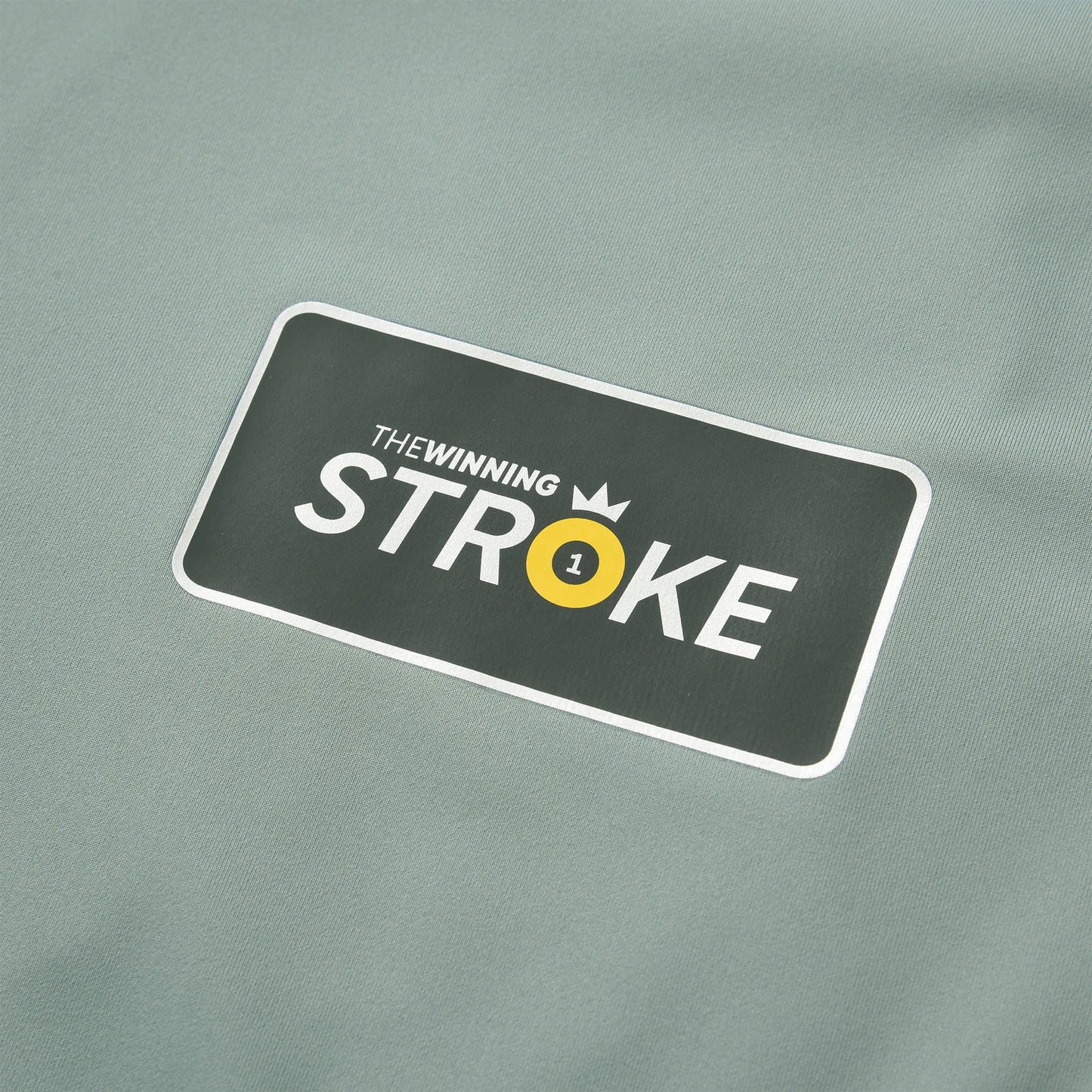 Close-up of the Winning Stroke logo printed on the Team Ontario billiards jersey.