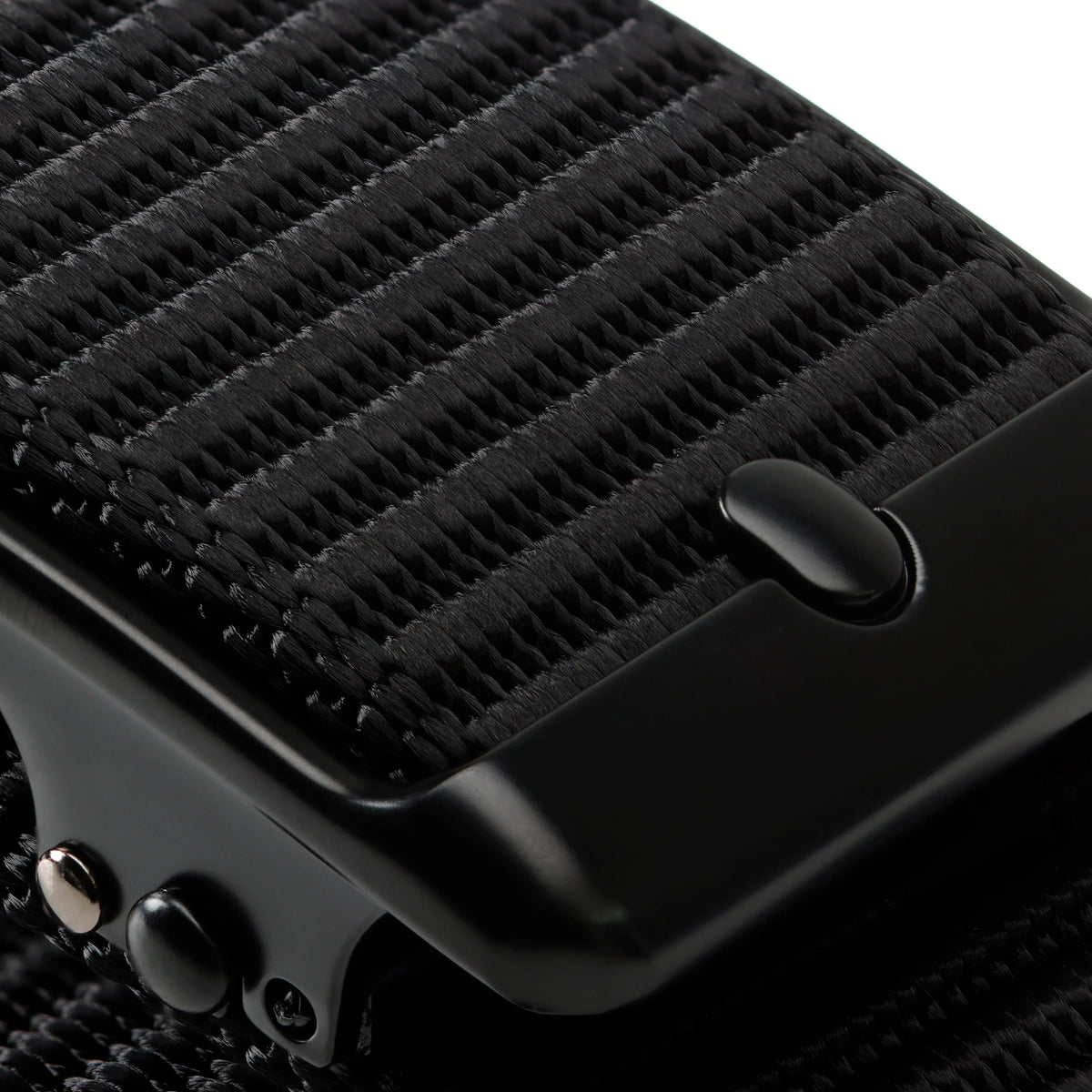 Close-up of the black Tournament Click Belt showing its woven strap texture and automatic buckle details.
