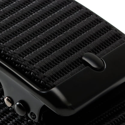 Close-up of the black Tournament Click Belt showing its woven strap texture and automatic buckle details.
